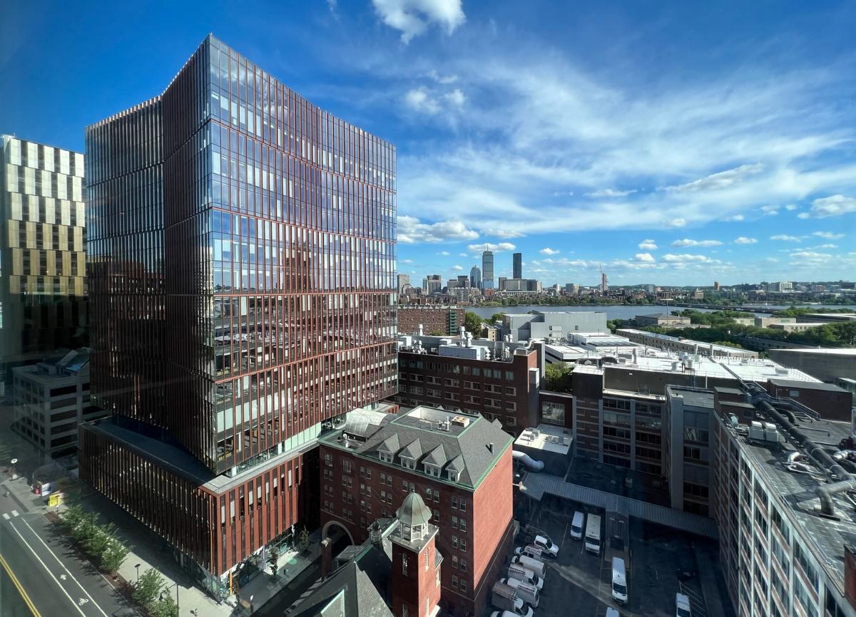 Boston skyline behind the Kendall Hotel and 314 Main St, Cambridge, Massachusetts.